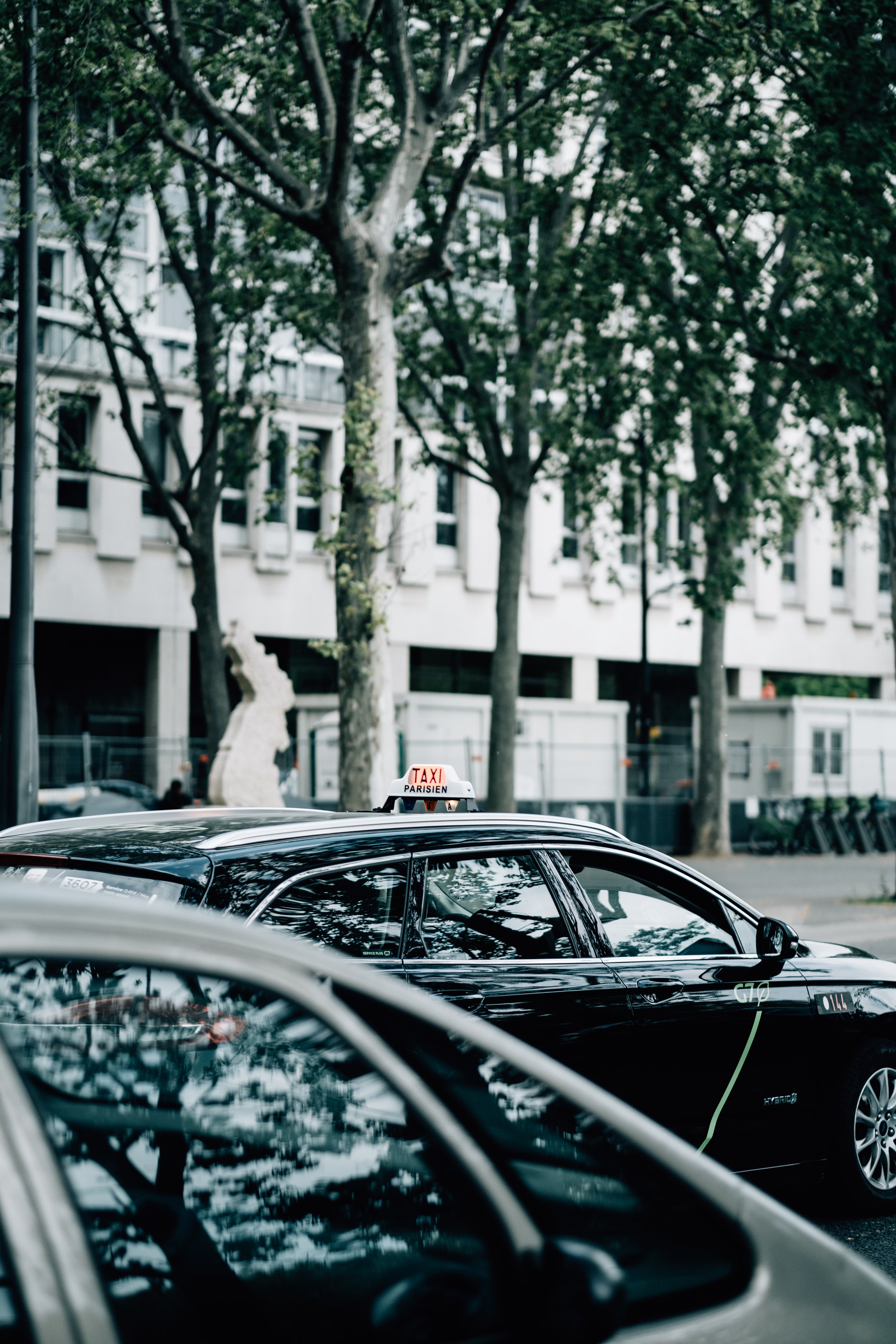 black-car-with-a-taxi-sign-on-its-roof.jpg